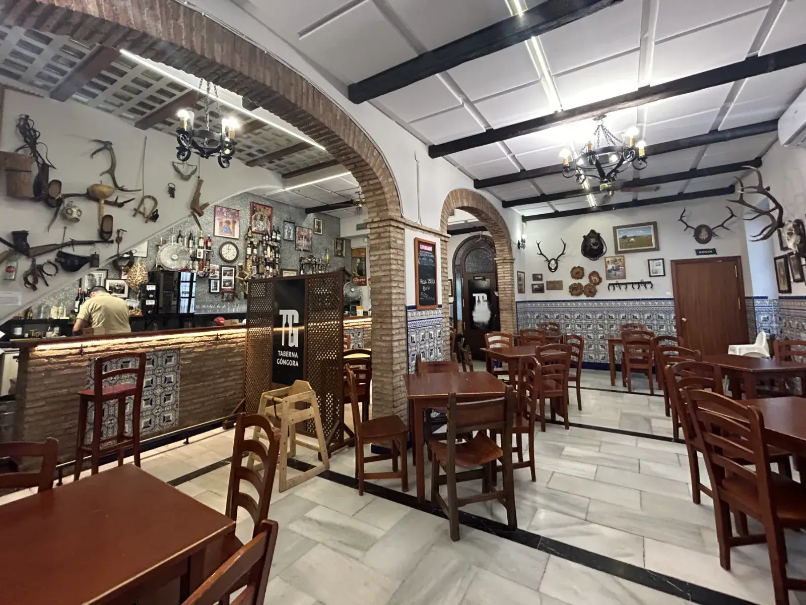 The dining room at Taberna Góngora, with its brick arches and tiles